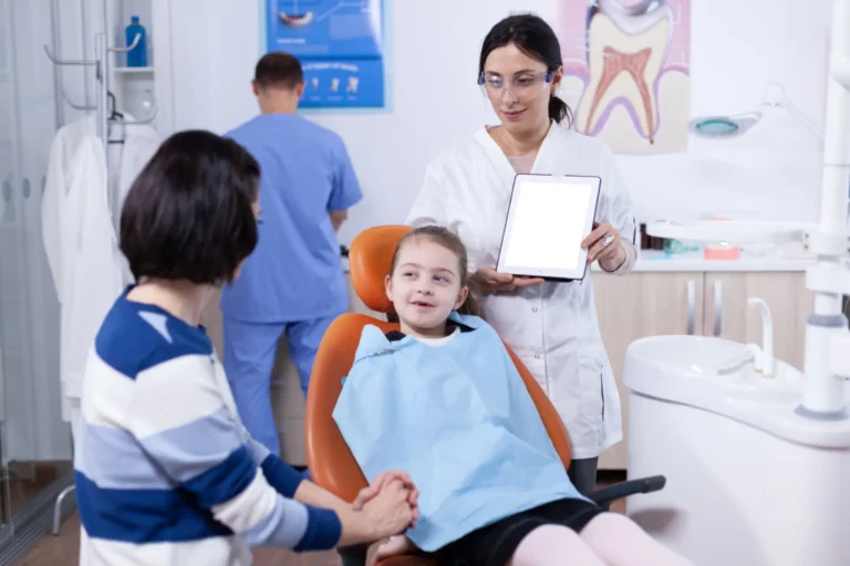 there is a woman and a child sitting in a dentist chair