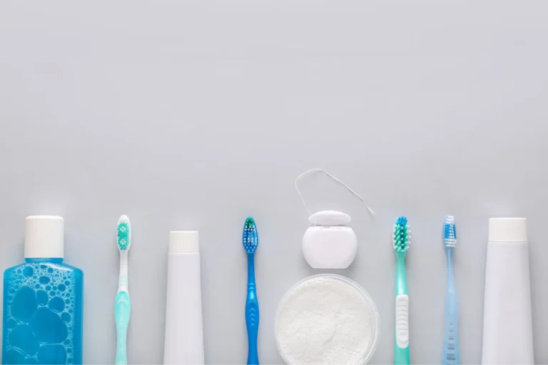 there are many different types of toothbrushes and toothpaste on a table