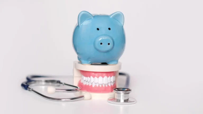 a close up of a piggy bank with a stethoscope and a toothbrush