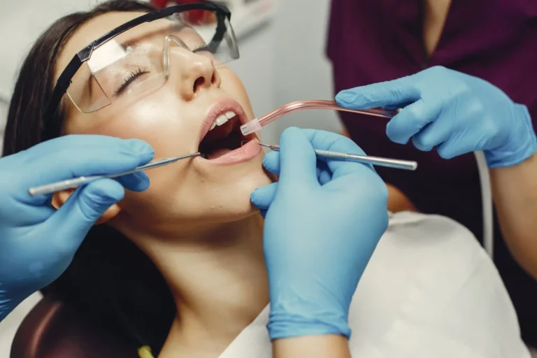 araffes in blue gloves and goggles are getting a dental check