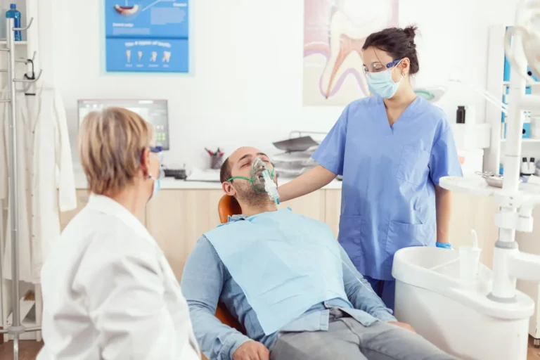 arafed male patient in a dental office with a mask on