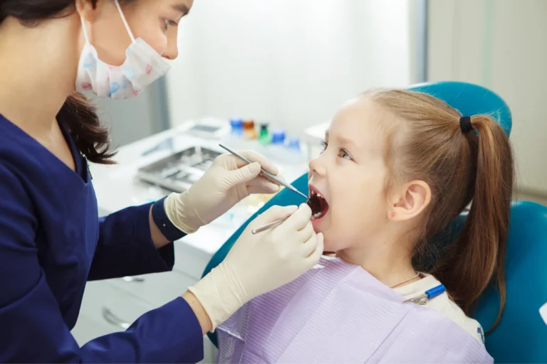 araffes in a dentist ' s chair with a little girl