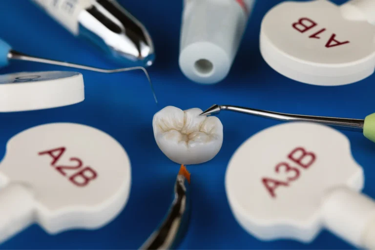 a close up of a tooth with a toothbrush and dental supplies