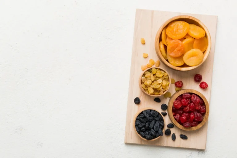 there are three bowls of fruit on a cutting board with a knife