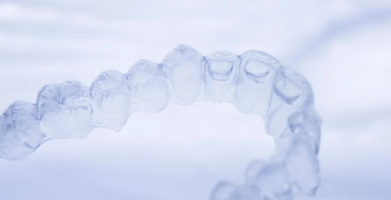 there is a close up of a tooth with a clear plastic cover