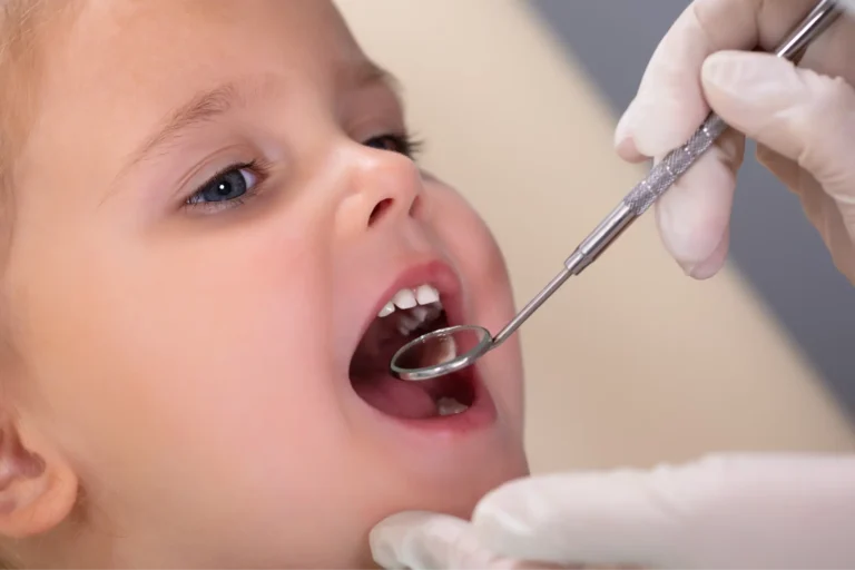 arafed child getting a dental check up at the dentist