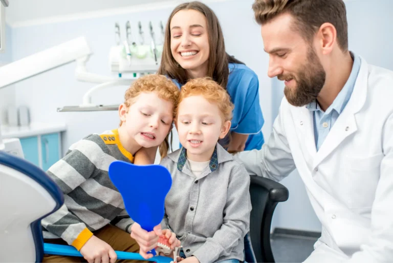 arafed boy sitting in a chair with a dentist and a woman