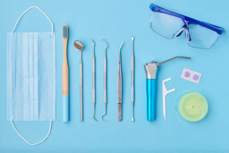 a close up of a blue table with a pair of glasses, a toothbrush, a pair