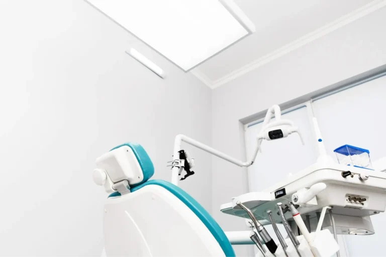 there is a dentist chair in a room with a skylight