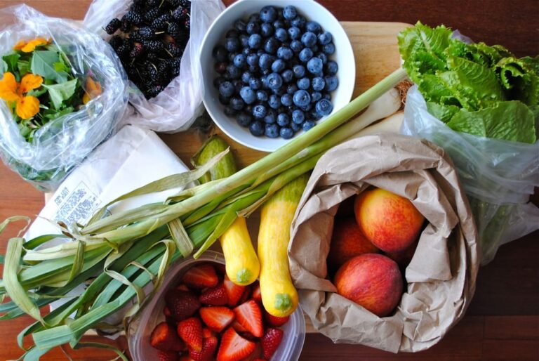 there are many fruits and vegetables on the table together