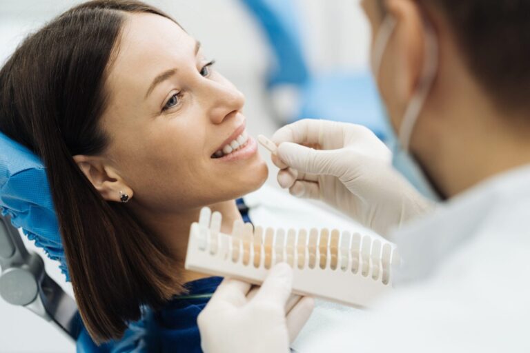 arafed woman getting her teeth checked by a dentist