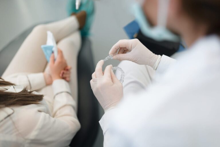 arafed woman getting her nails done by a doctor