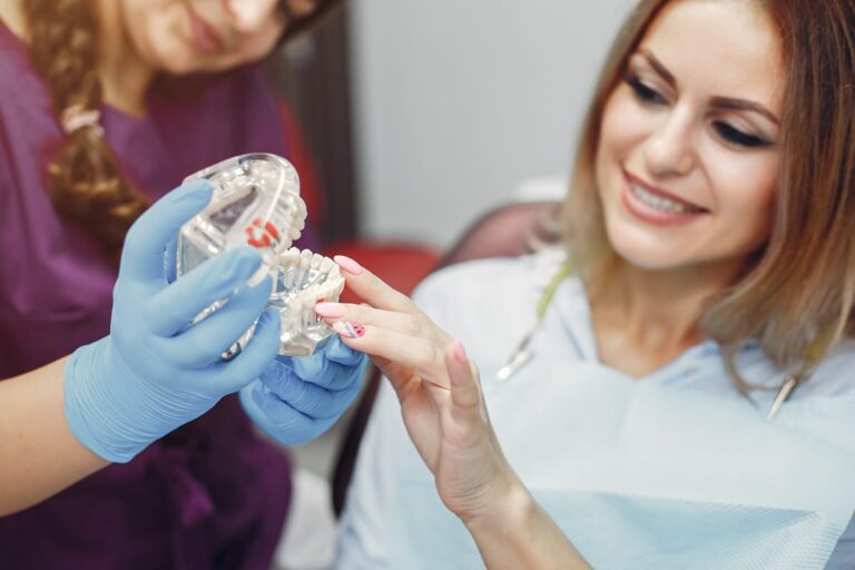 arafed woman in a dentist ' s chair holding a toothbrush and a dental worker