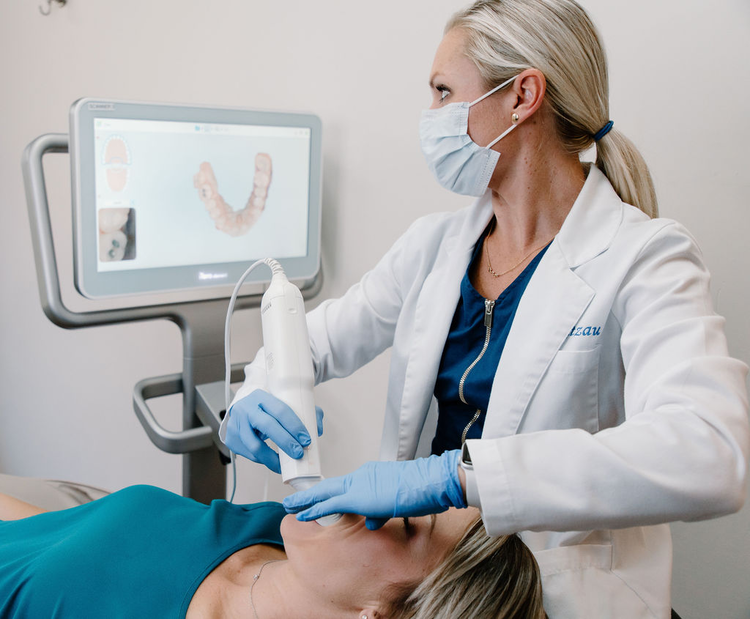 arafed woman getting a dental treatment in a dental clinic