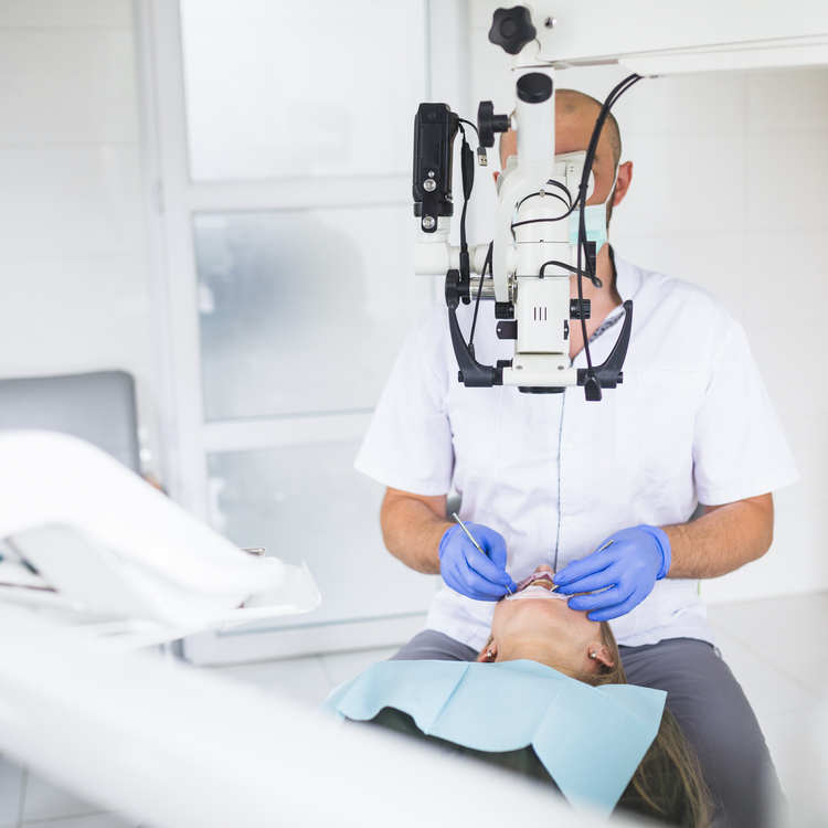 arafed male dentist with a patient in a dental room