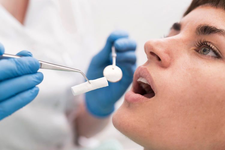 someone is getting their teeth brushed by a dentist