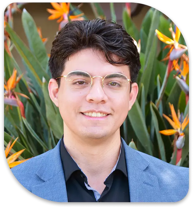 a close up of a man wearing glasses and a suit jacket